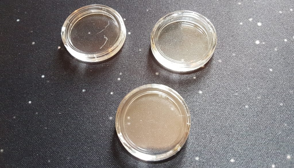 Scratched coin capsules
